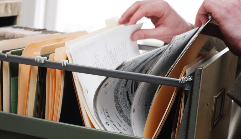 Paperwork in a filing cabinet.