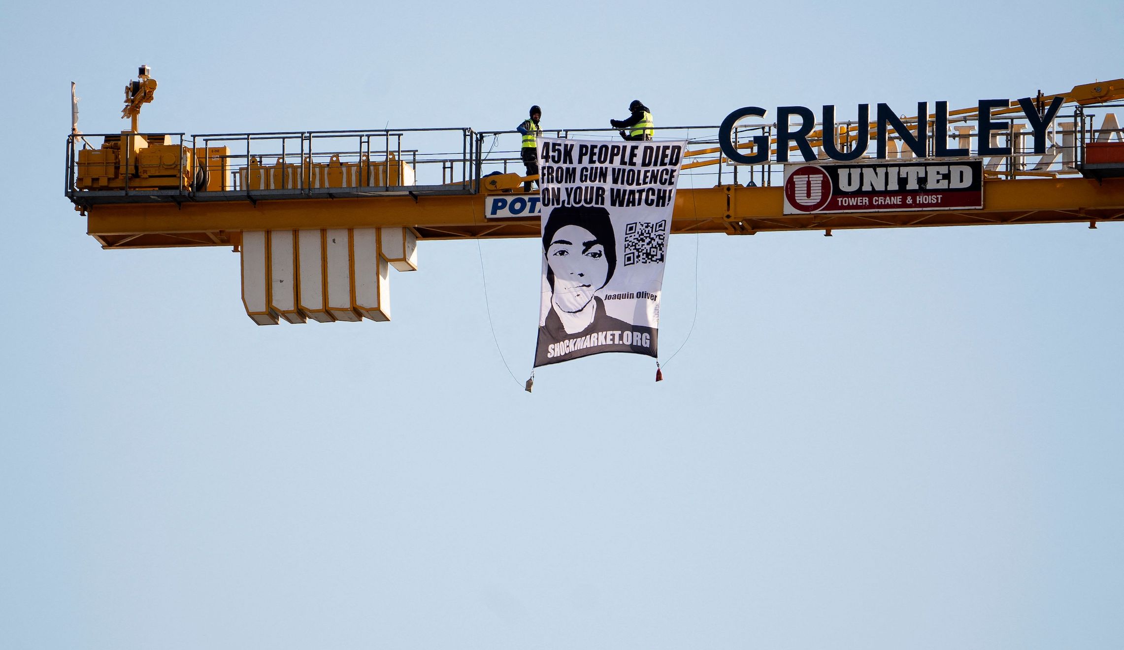 Father of Parkland shooting victim protests atop construction crane near White House