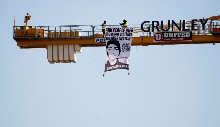 Father of Parkland shooting victim protests atop construction crane near White House