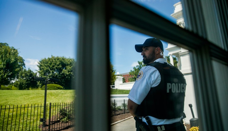 A uniformed U.S. Secret Service Police officer stands outside the press briefing room of the White House during a lockdown, Wednesday June 19, 2019, in Washington.