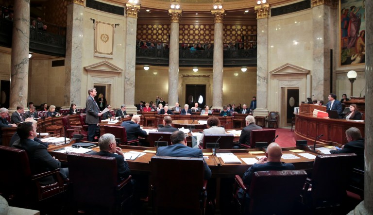 State Sen. Tim Carpenter Carpenter, D - Milwaukee, left, speaks during a special session of the senate, Tuesday Dec. 4, 2018, at the Capitol in Madison, Wis.