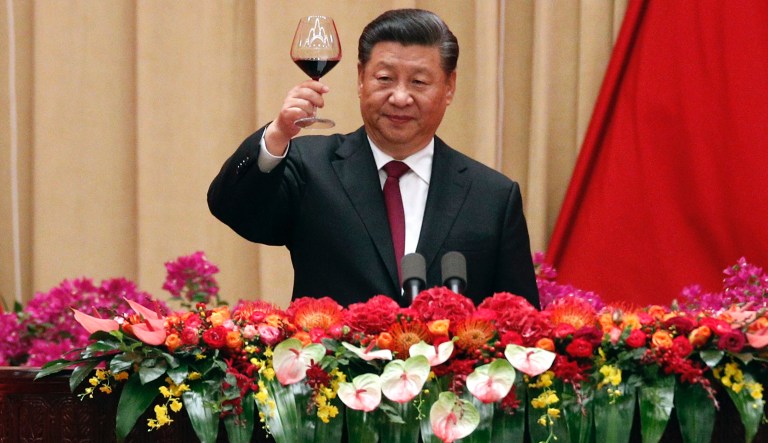 Chinese President Xi Jinping makes a toast after delivering his speech at a dinner marking the 70th anniversary of the founding of the People's Republic of China at the Great Hall of the People in Beijing, Monday, Sept. 30, 2019. (AP Photo/Andy Wong)