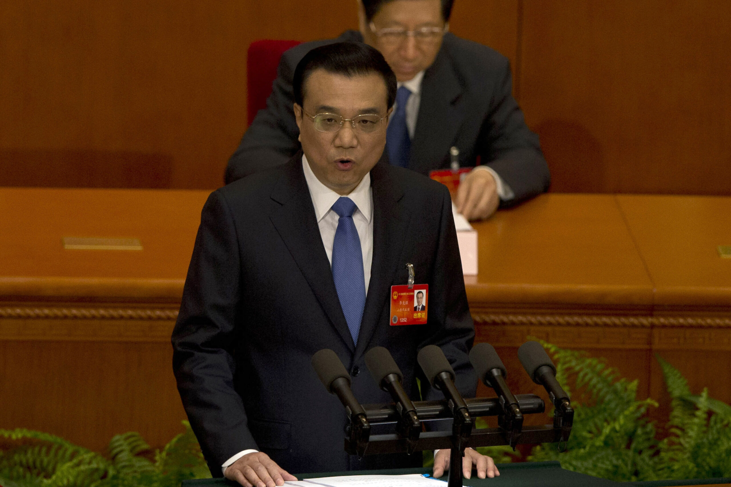 China vows to address stifling smog, terror threat