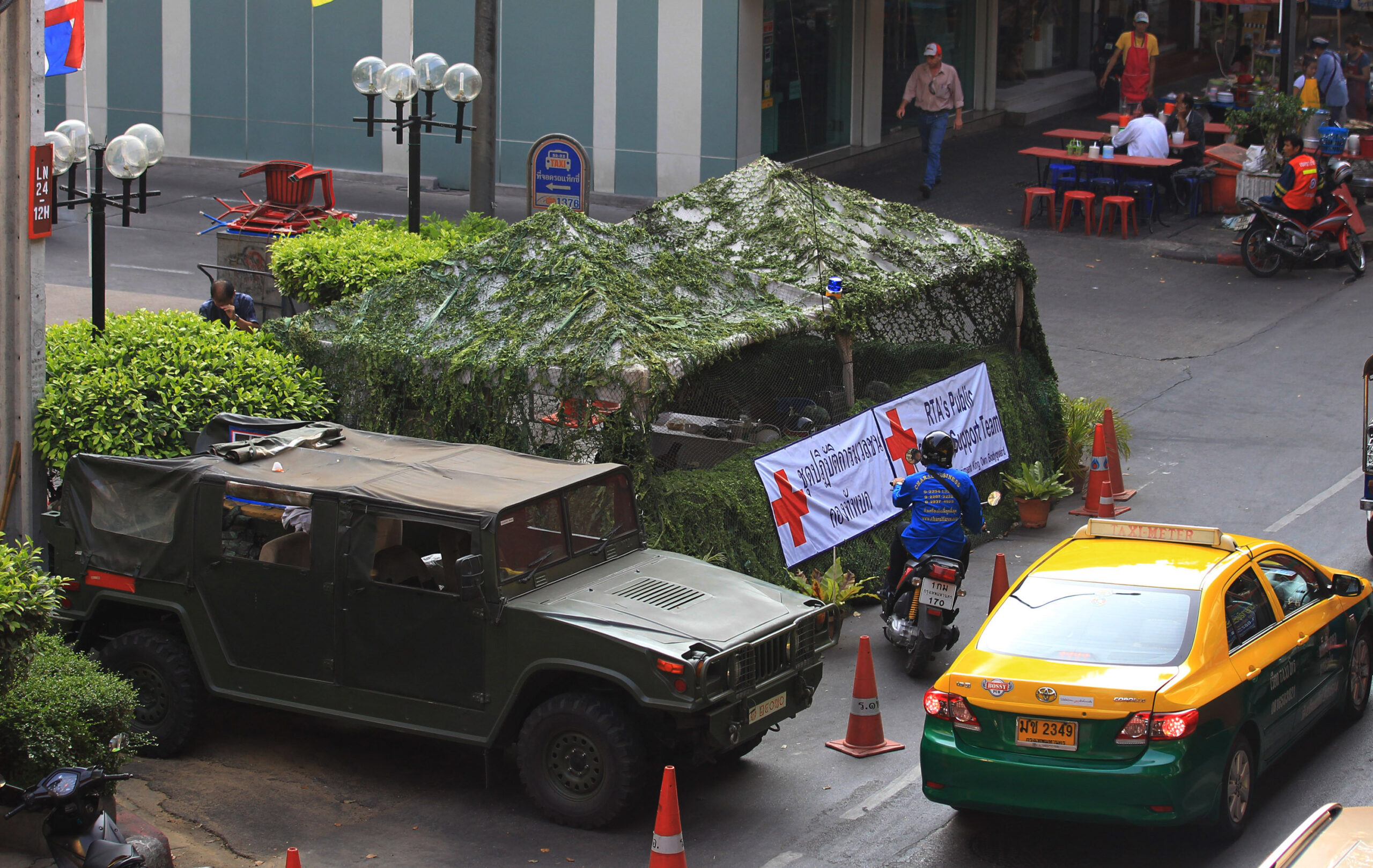 Army checkpoints in Bangkok get flowery makeover