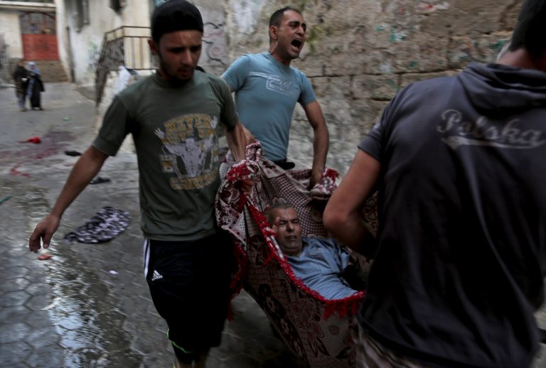 Deadly Israeli strikes hit UN school, market area
