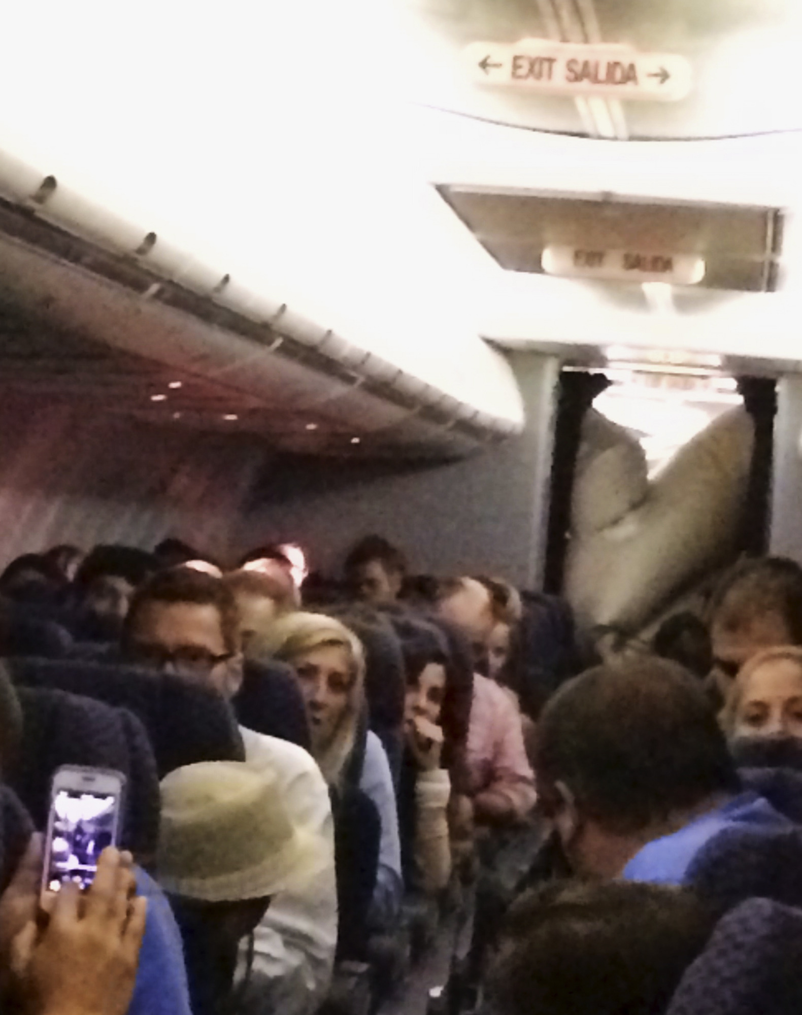 United plane’s evacuation slide deploys mid-flight