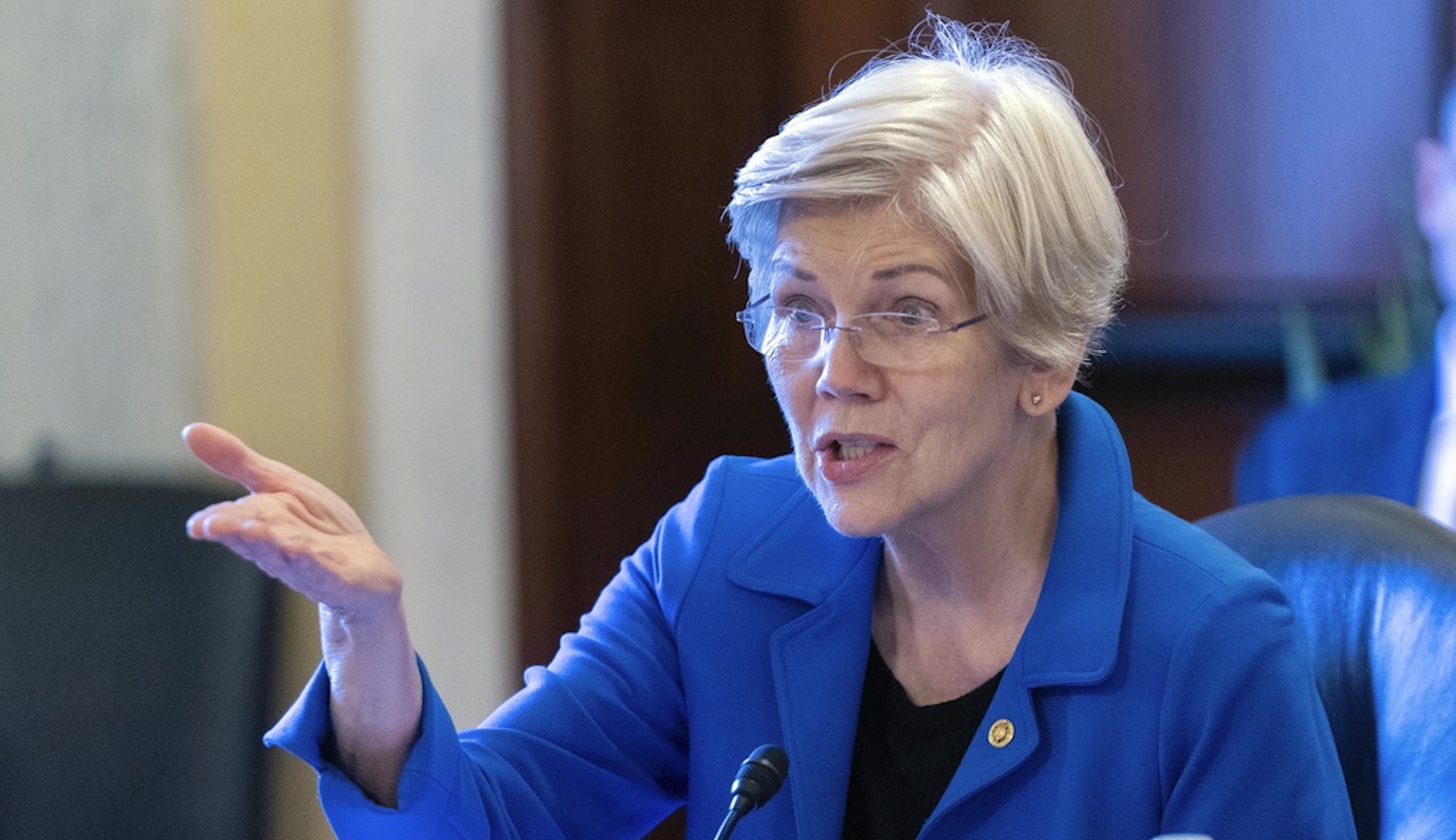 Warren calls for Biden administration to block ‘dangerous’ Capital One buyout of Discover