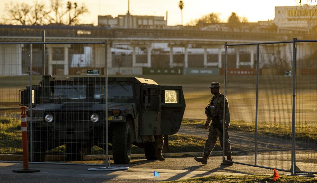 Texas Department of Public Safety officers guard an entrance to Shelby Park on Thursday, Jan. 11, 2024, in Eagle Pass, Texas. The Justice Department on Friday, Jan. 12, asked the Supreme Court to order Texas to stop blocking Border Patrol agents from a portion of the U.S.-Mexico border where large numbers of migrants have crossed in recent months, setting up another showdown between Republican Gov. Greg Abbott and the Biden administration over immigration enforcement. (Sam Owens
/The San Antonio Express-News via AP)