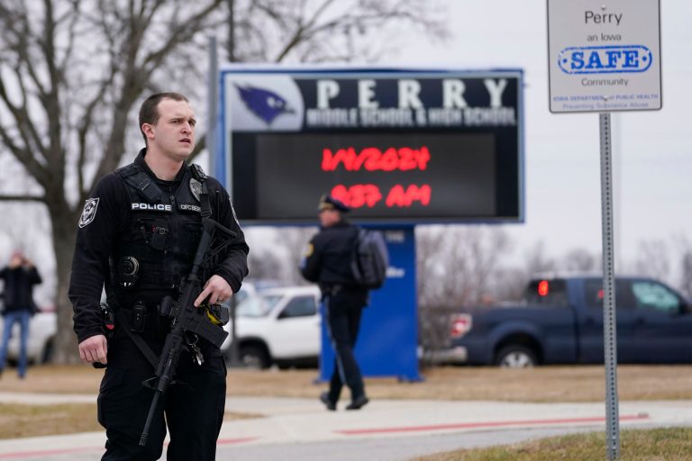 Iowa principal who distracted shooter died from injuries