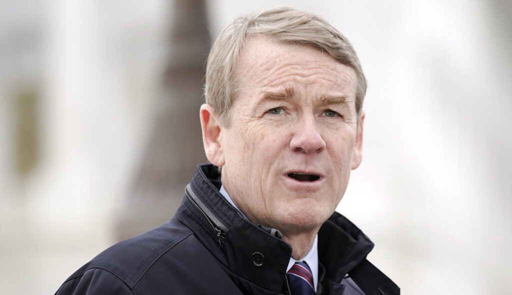 Sen. Michael Bennet (D-CO) speaks at a news conference about the need for Congress to take action to support communities that receive migrants, Thursday, Jan. 18, 2024, at the U.S. Capitol in Washington. (AP Photo/Mariam Zuhaib)