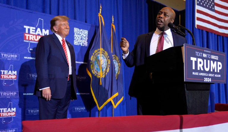 Sen. Tim Scott (R-SC) speaks alongside former President Donald Trump at a campaign event in Concord, N.H., Friday, Jan. 19, 2024. (AP Photo/Matt Rourke)