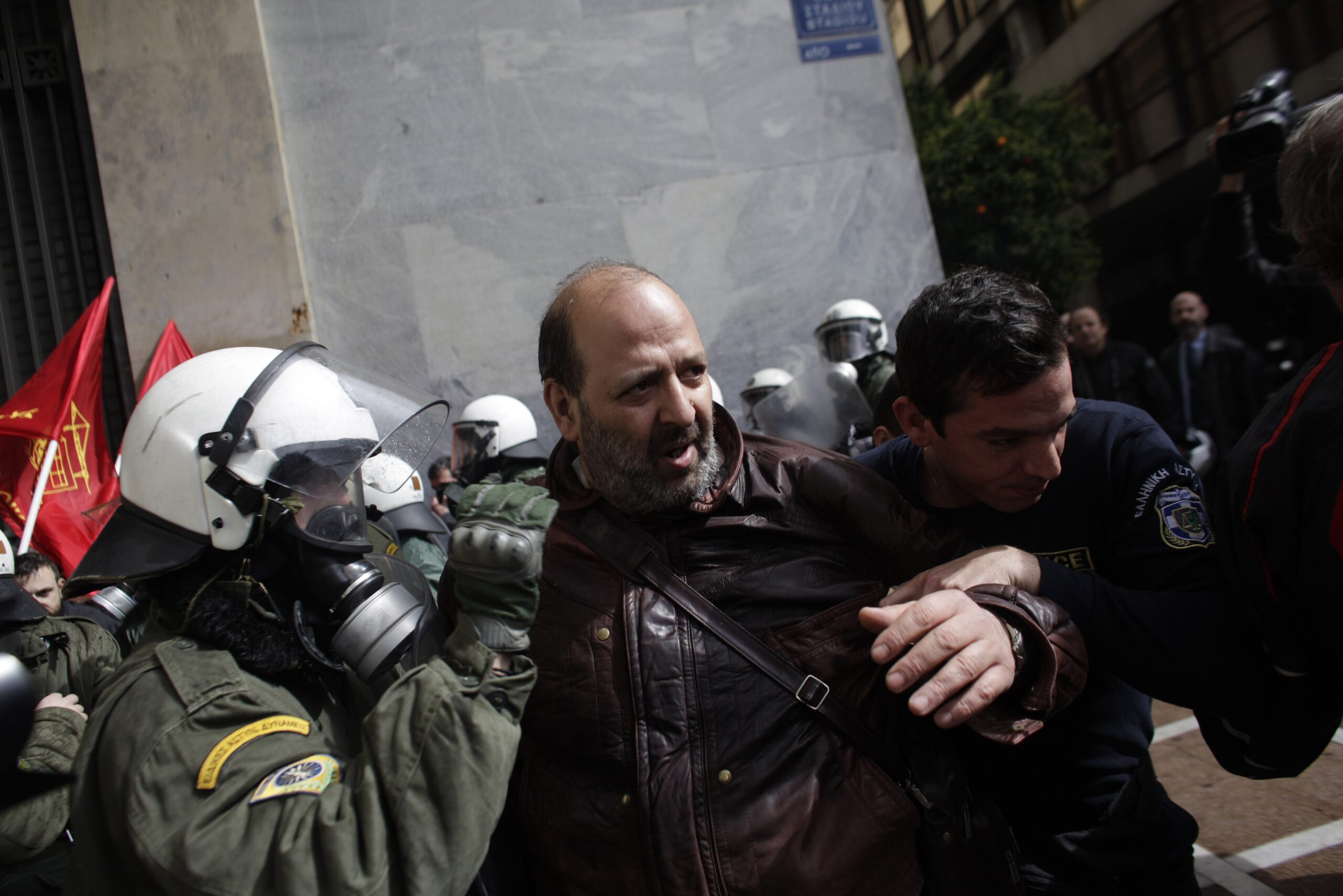 Greek protesters, riot police scuffle in Athens