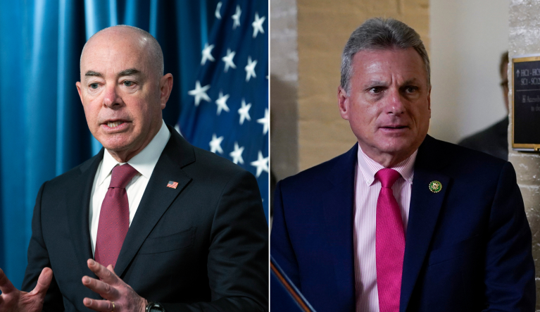 Alejandro Mayorkas, left, and Rep. Buddy Carter (R-GA), right.