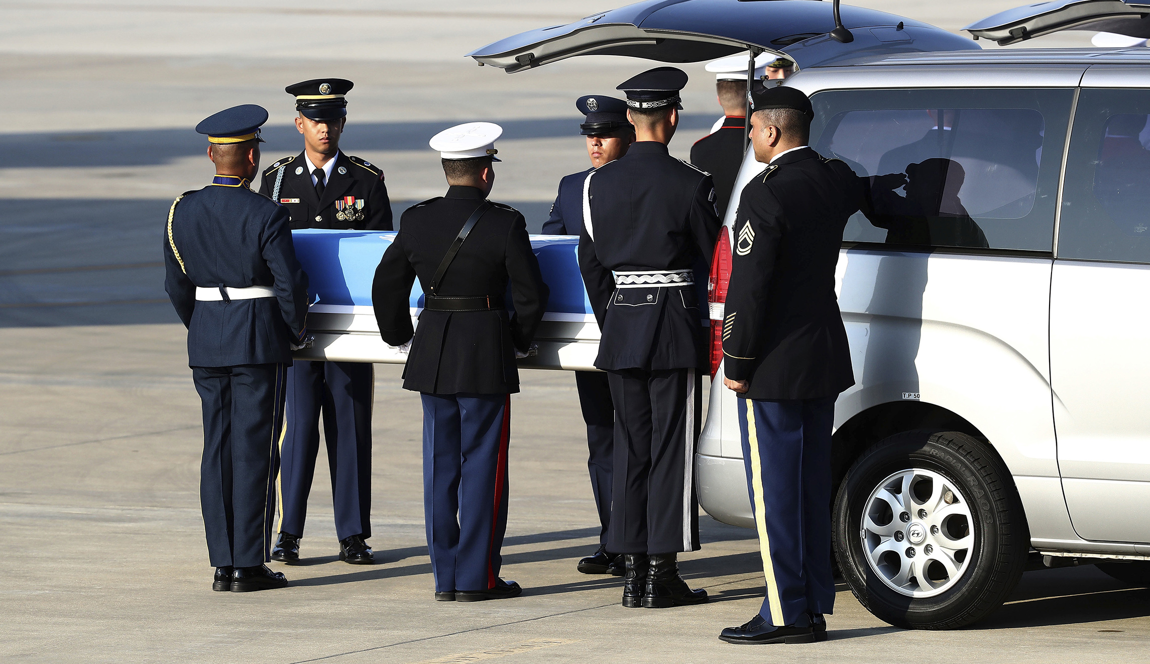 Presumed US war remains handed over by North Korea begin journey home after ceremony in South Korea