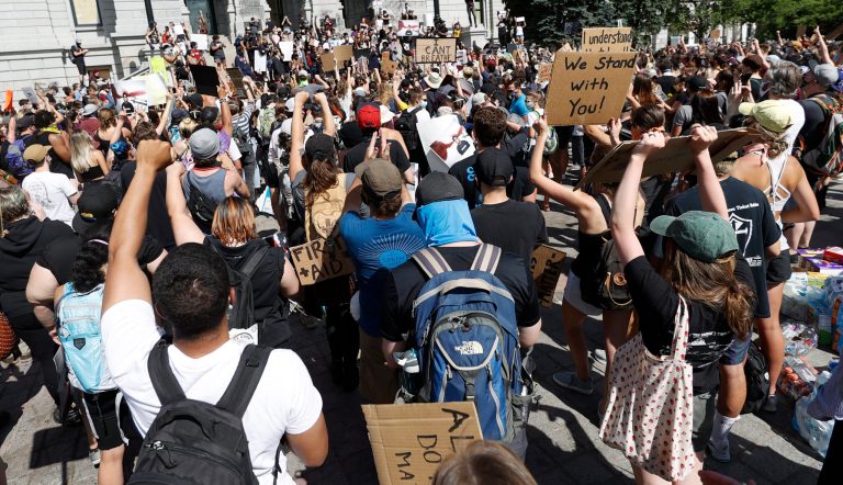 Counterprotesters confront ‘Back the Blue’ activists in Denver, burn MAGA hats, and chant over pro-police crowd