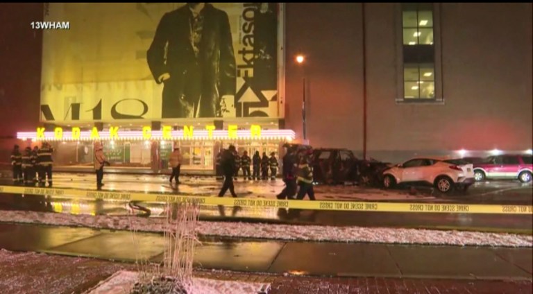 Rochester police investigate a fatal fiery crash outside the Kodak Center in Rochester, New York, on Jan. 1, 2024.  A Ford Expedition struck a Mitsubishi Outlander, sending both vehicles âthrough a group of pedestrians that were in the crosswalk,â the statement read.  