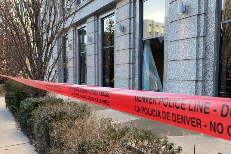 Police tape blocks the damage to large windows at the Colorado Supreme Court on Tuesday, Jan. 2, 2024, in Denver.