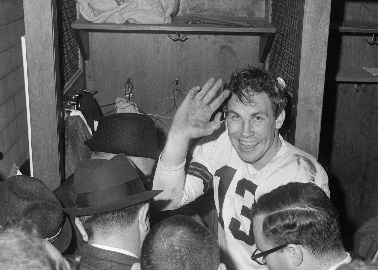 Cleveland Browns quarterback Frank Ryan gestures in the dressing room as he talks with reporters after the Browns defeated the Indianapolis Colts 27-0 in the NFL championship football game in Cleveland, Ohio, Dec. 27, 1964.