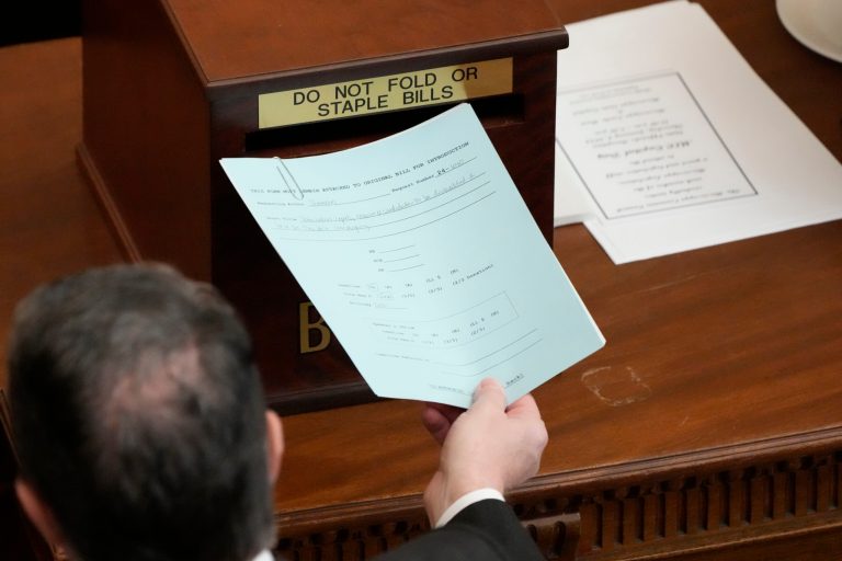 Mississippi state Rep. Jody Steverson places a bill into the bill collection box in the Mississippi House of Representatives Chamber, Wednesday, Jan. 3, 2024, in Jackson, Mississippi.