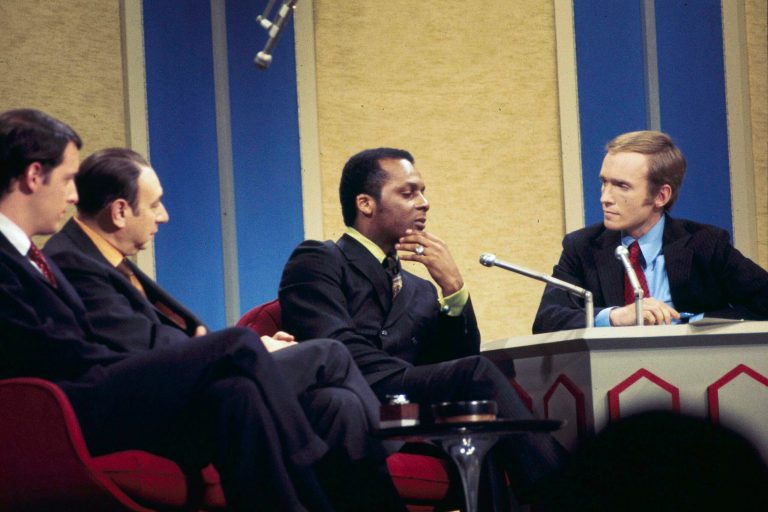 Curt Flood of the St. Louis Cardinals, center, is seen on the 