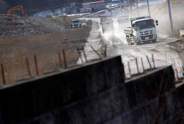 Construction crunch slows Japan tsunami rebuilding