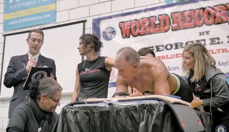 Former Marine, 62, planks for more than 8 hours to set world record