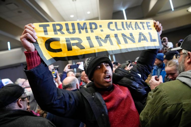 Trump’s final rally before Iowa caucuses interrupted by climate protesters