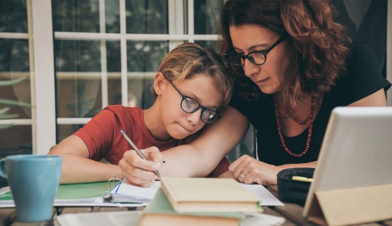 Mother homeschooling her child.