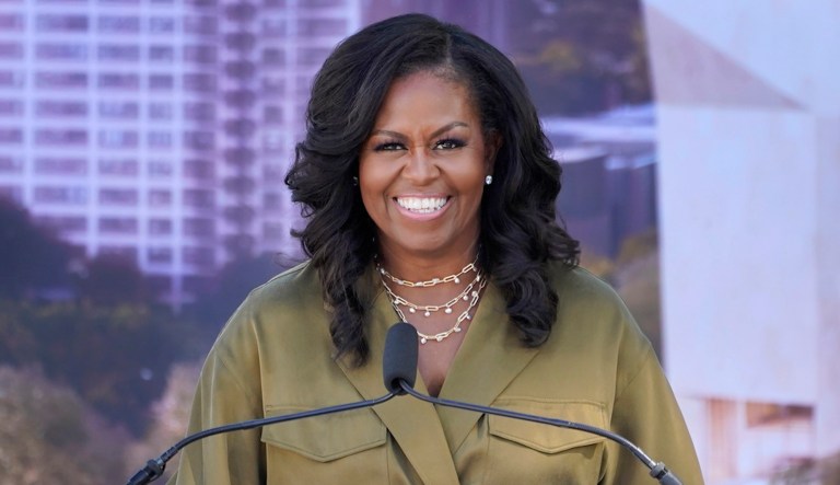 Former first lady Michelle Obama smiles as she speaks during a groundbreaking ceremony for the Obama Presidential Center in Chicago on Sept. 28, 2021. (AP Photo/Charles Rex Arbogast, File)