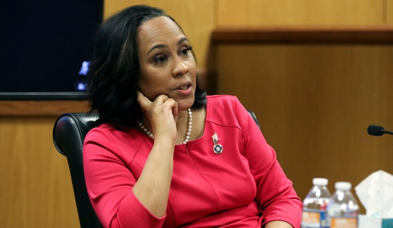Fulton County District Attorney Fani Willis testifies during a hearing on the Georgia election interference case, Thursday, Feb. 15, 2024, in Atlanta. The hearing is to determine whether Willis should be removed from the case because of a relationship with Nathan Wade, special prosecutor she hired in the election interference case against former President Donald Trump. (Alyssa Pointer/Pool Photo via AP)