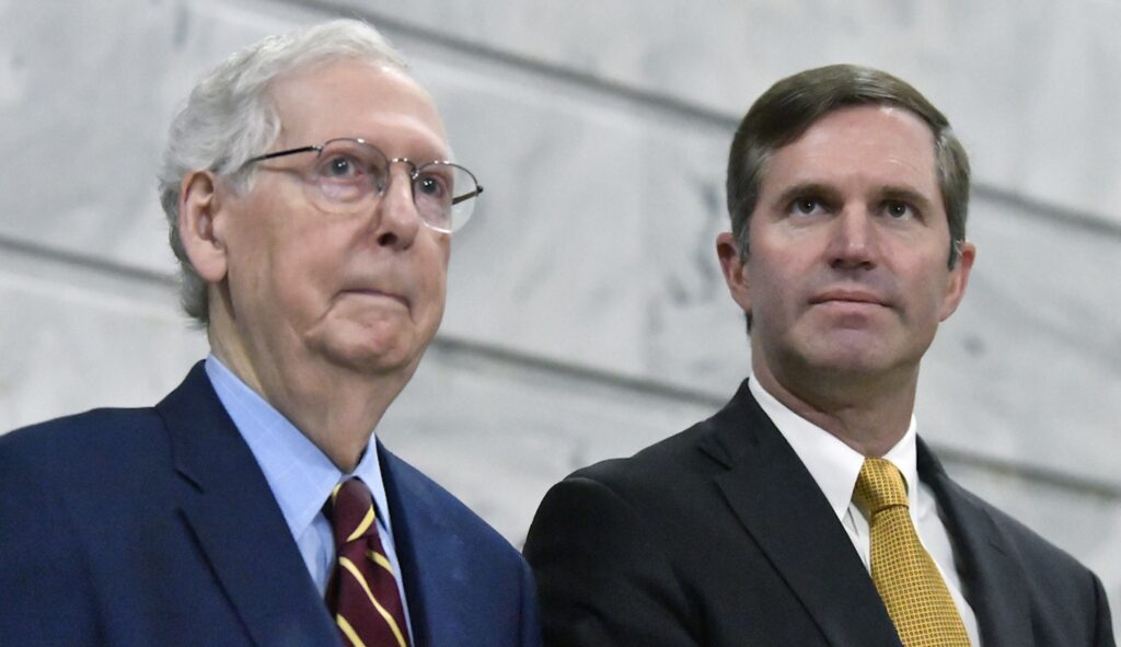 Senate Minority Leader Mitch McConnell (R-KY) speaks with Kentucky Governor Andy Beshear during a ceremony in the Rotunda at the Kentucky State Capitol in Frankfort, Ky., Tuesday, Jan. 2, 2024. (AP Photo/Timothy D. Easley)