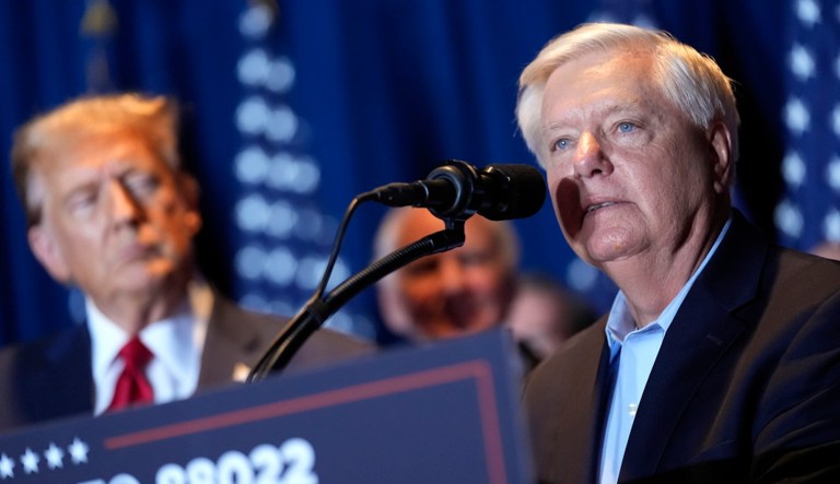 Sen. Lindsey Graham (R-SC) speaks as Republican presidential candidate former President Donald Trump listens at a primary election night party at the South Carolina State Fairgrounds in Columbia, S.C., Saturday, Feb. 24, 2024. (AP Photo/Andrew Harnik)