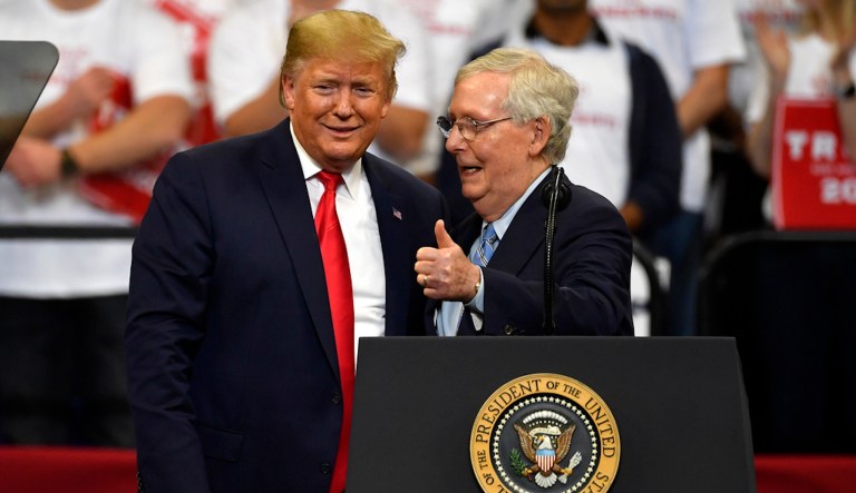 President Donald Trump and Senate Majority Leader Mitch McConnell (R-KY) greet each other during a campaign rally in Lexington, Ky., Nov. 4, 2019. (AP Photo/Timothy D. Easley, File)