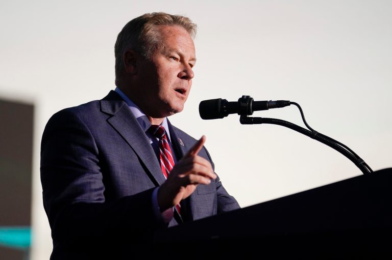 Rep. Warren Davidson, R-Ohio, speaks before former President Donald Trump at a rally in support of the campaign of Ohio Senate candidate JD Vance at Wright Bros. Aero Inc. at Dayton International Airport on Monday, Nov. 7, 2022, in Vandalia, Ohio. (AP Photo/Michael Conroy)