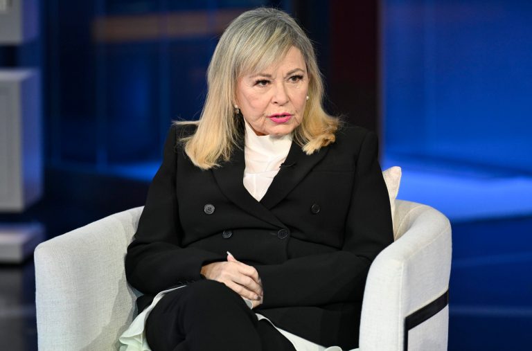 Roseanne Barr jokes Biden assaulted her while trying on shoes in department store