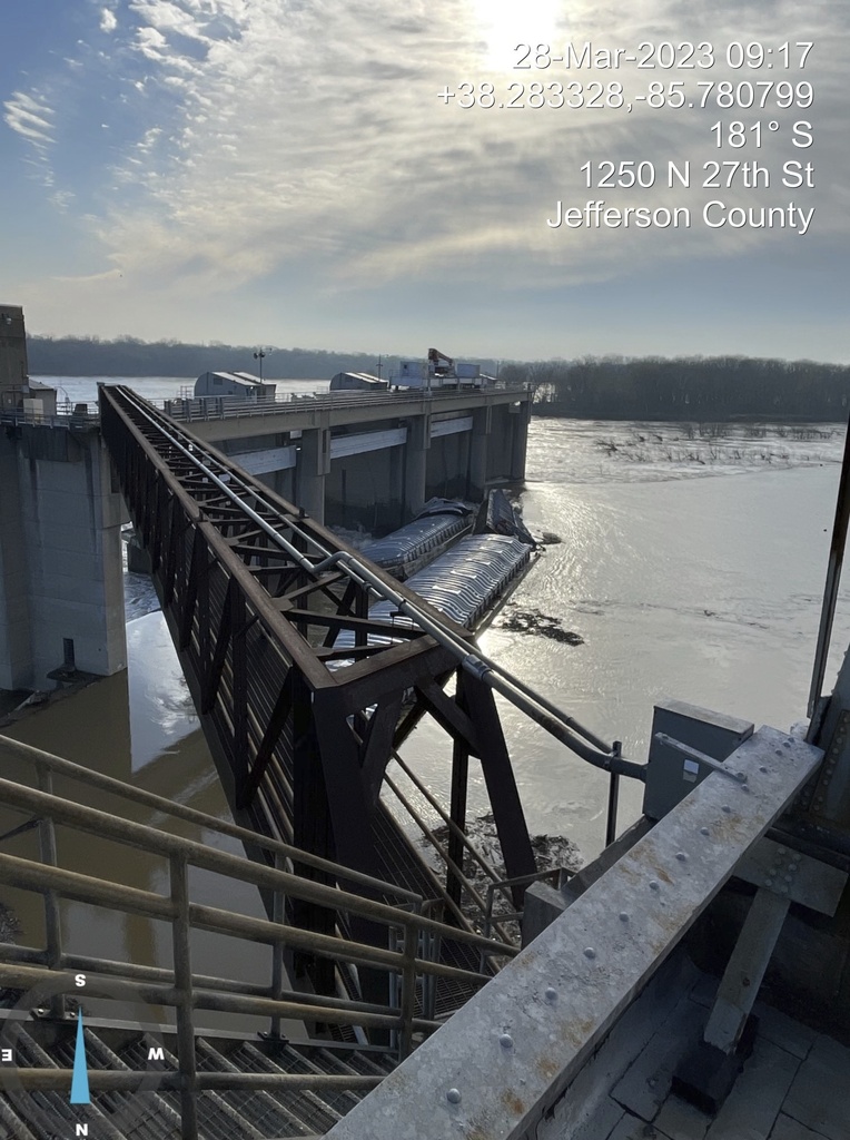 River barges break loose in Pittsburgh, causing damage and closing bridges before some go over a dam