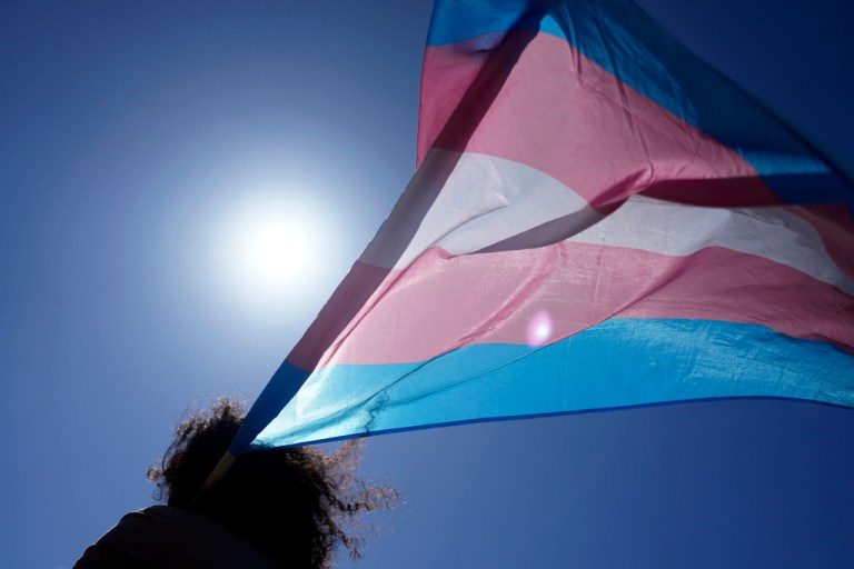An attendee carries a transgender flag during a march to celebrate International Transgender Day of Visibility, Sunday, March 31, 2024, in Lisbon, Portugal.
