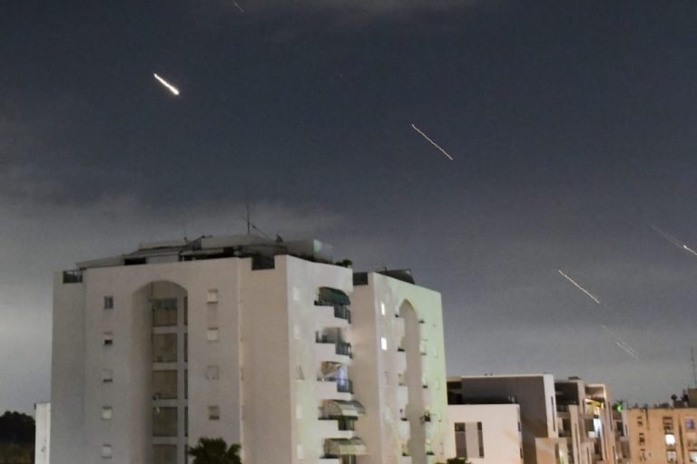 Israeli Iron Dome air defense system launches to intercept missiles.