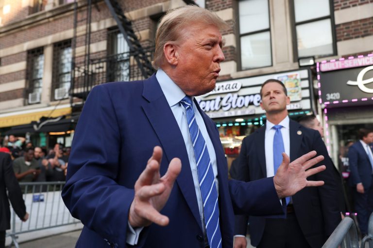 Former president Donald Trump, talks to members of the media while visiting a bodega, Tuesday, April 16, 2024, who's owner was attacked last year in New York. Fresh from a Manhattan courtroom, Donald Trump visited a New York bodega where a man was stabbed to death, a stark pivot for the former president as he juggles being a criminal defendant and the Republican challenger intent on blaming President Joe Biden for crime. Alba's attorney, Rich Cardinale, second from left, and Fransisco Marte, president of the Bodega Association, looked on. (AP Photo/Yuki Iwamura)