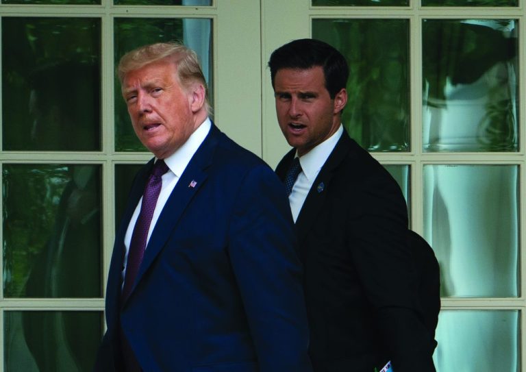 President Donald Trump, with Director of the White House Presidential Personnel Office John McEntee, walks to the Oval Office as he returns to the White House.
