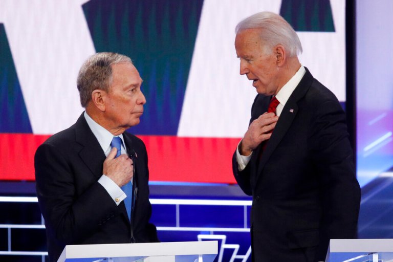Democratic presidential candidates, former New York City Mayor Mike Bloomberg, left, and former Vice President Joe Biden talk during a break in a Democratic presidential primary debate hosted by NBC News and MSNBC, Wednesday, Feb. 19, 2020, in Las Vegas.