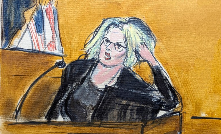 Stormy Daniels testifies in Manhattan criminal court, Tuesday, May 7, 2024, in New York, about the encounter in former President Donald Trump's hotel penthouse, showing how she found Trump in his bedroom lying on his bed. (Elizabeth Williams via AP)