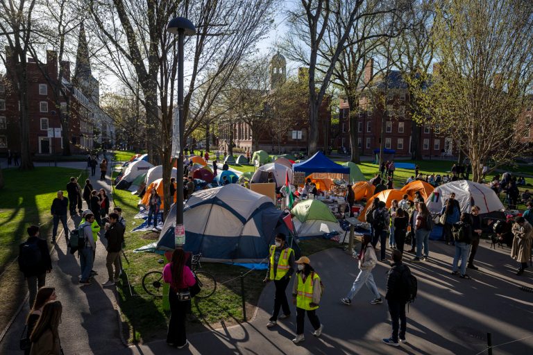 Students protesting against the war in Gaza, and passersby walking through Harvard Yard, are seen at an encampment at Harvard University in Cambridge, Mass., on April 25, 2024. Participants at the Harvard encampment protesting the war between Israel and Hamas announced they were voluntarily ending their occupation of Harvard Yard. The student protest group said in a statement that the encampment “outlasted its utility with respect to our demands,” and interim Harvard University President Alan Garber agreed to pursue a meeting between those involved in the protest and university officials.