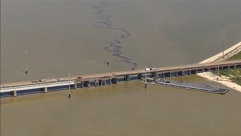 Texas bridge partially collapses after barge rams into it and causes oil spill
