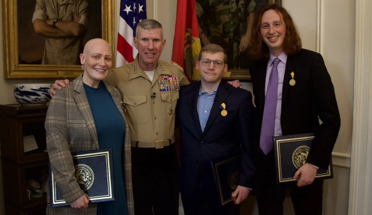Civilians who saved head of Marines after he suffered medical emergency receive award