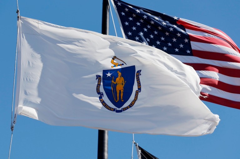 The Massachusetts state flag flies in Boston, Saturday, Sept. 24, 2022. (AP Photo/Michael Dwyer)