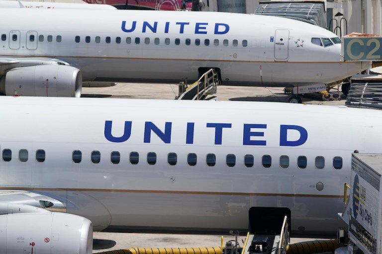 United flight aborts takeoff after engine catches on fire