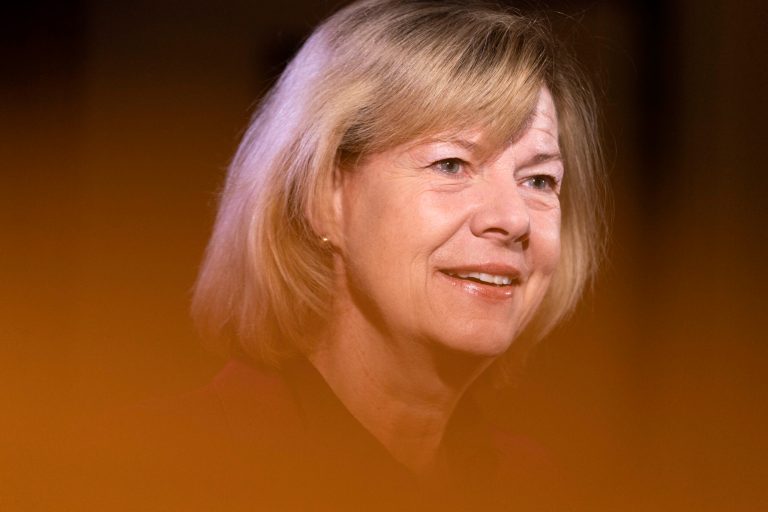 Tammy Baldwin says the 1% abuse lucrative tax loopholes. Her partner mastered them