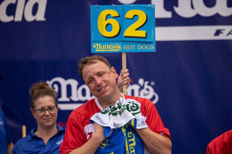 Joey Chestnut and soldiers compete in July Fourth hot dog eating contest at Army base