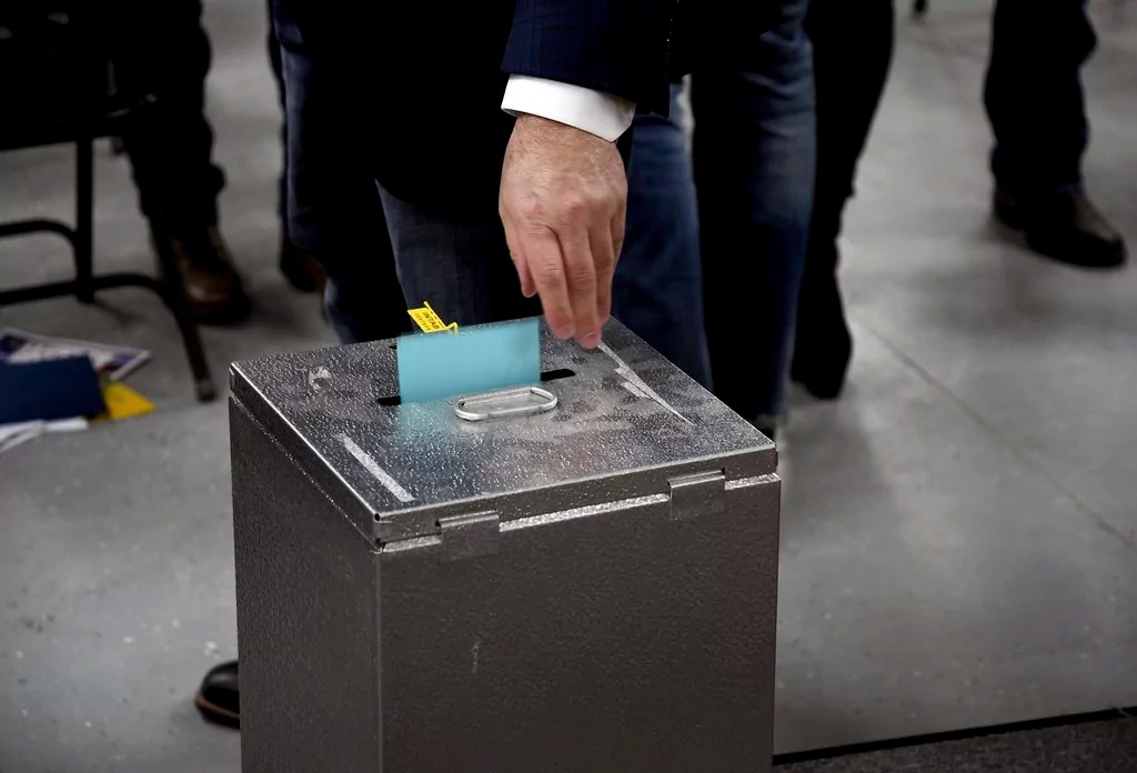Georgians, voters in other states to cast ballots in a divided country